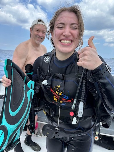 Happy face of a scuba diver finishing their Open Water Certification dives